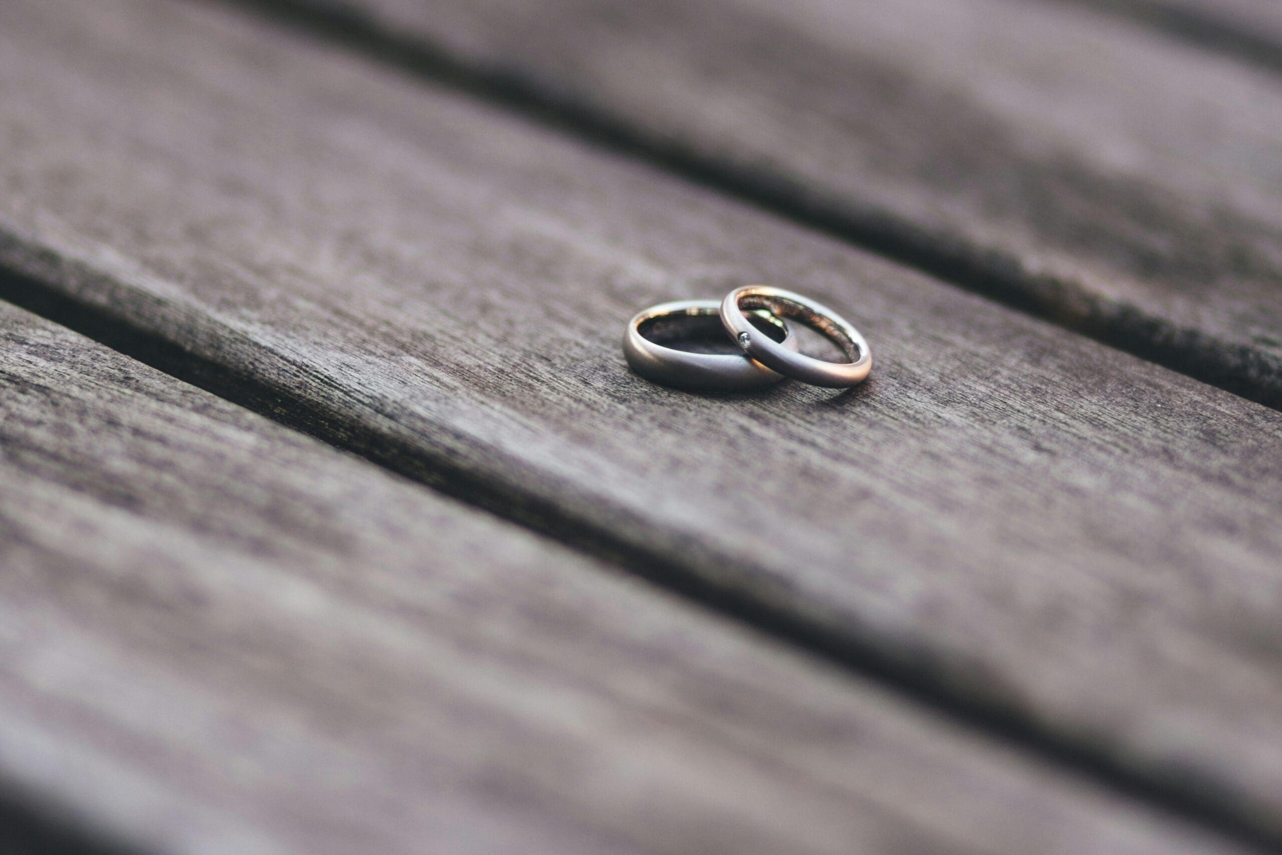 two rings on a piece of wood waiting for marriage registration thailand